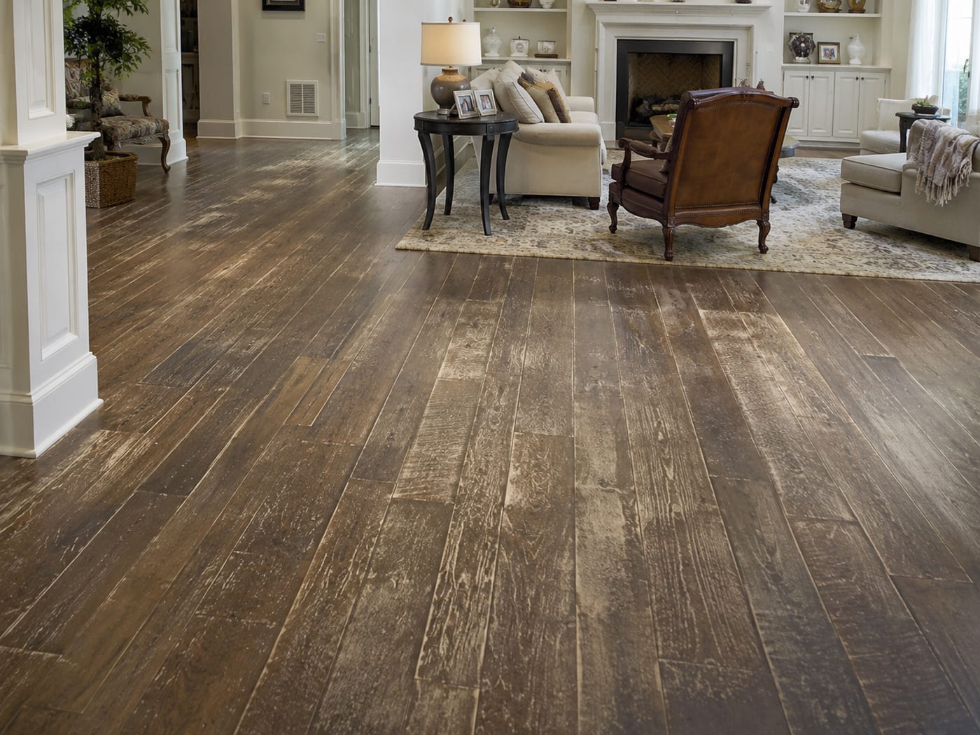 Hardwood living room floor in a light, rustic tone before a custom color change